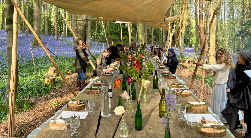 Shared experiences - A Woodland Feast - A table laid in a woodland, surrounded by bluebells