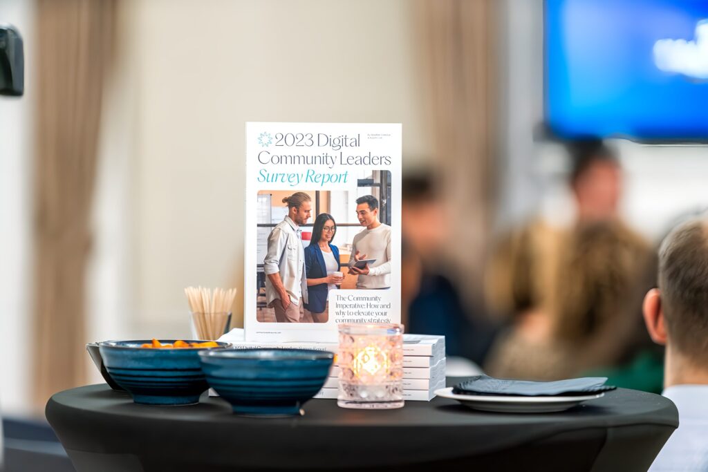 Image of a printed copy of the digital community leaders report on a table at the launch event