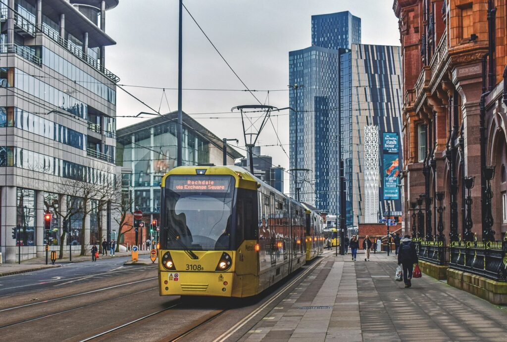 A shot of Manchester buildings showing a tram on rails