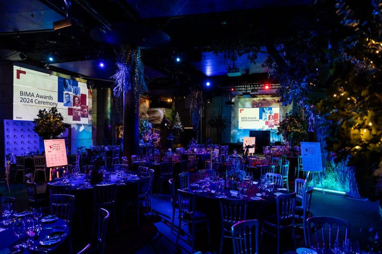Photo of the Underglobe venue space dramatically lit for the BIMA awards 2024