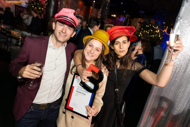 Group of people posing for photo at BIMA awards 2024 wearing some fancy dress items and smiling